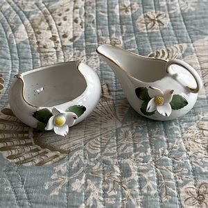 Creamer and sugar made in Japan tiny porcelain white flowers green leaves trim